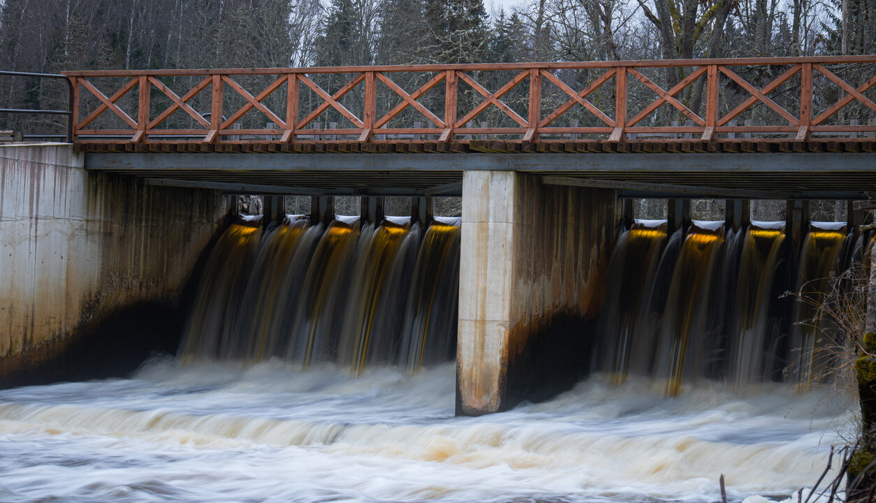 Flowing Water Under Wooden Bridge Dam